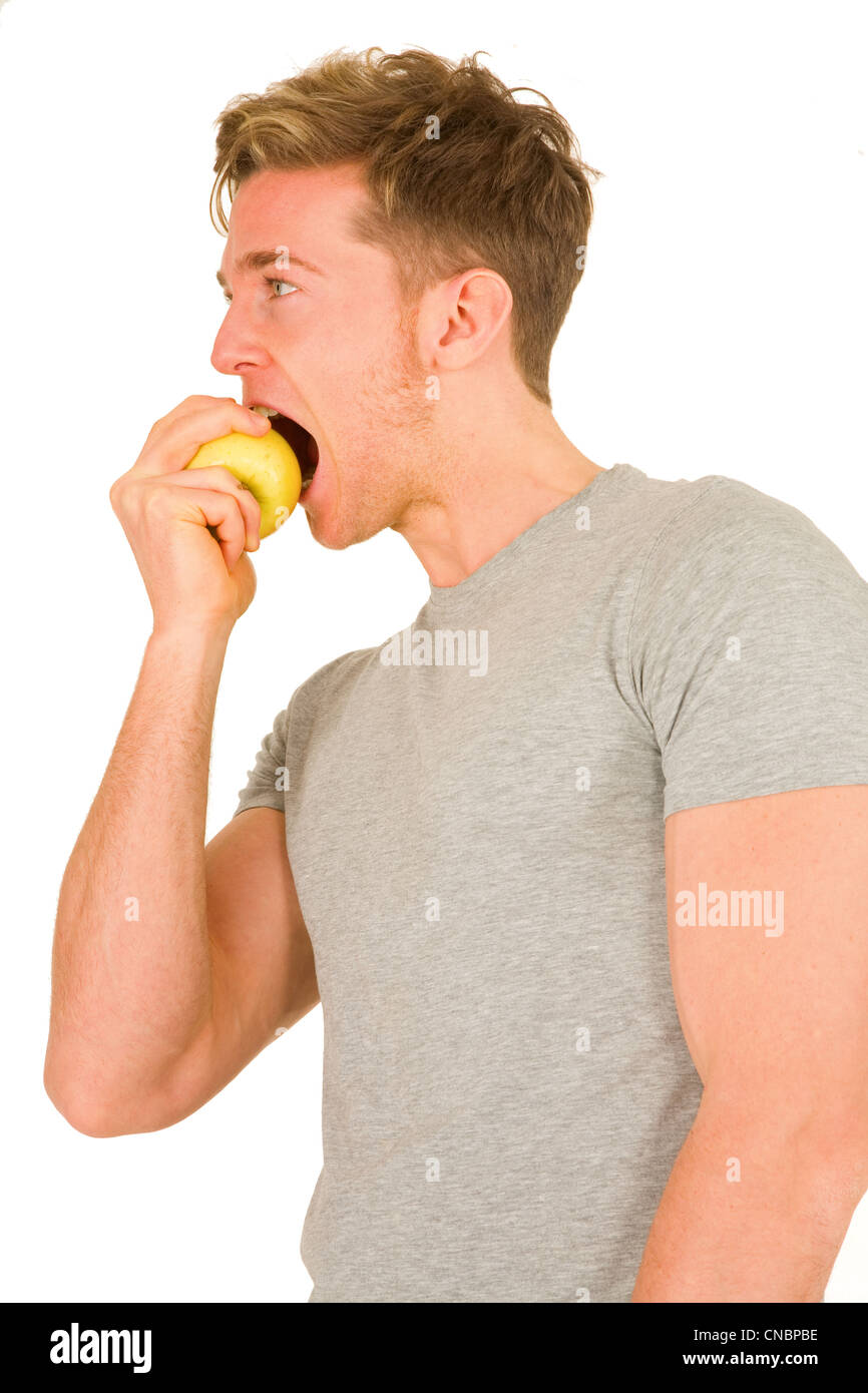 young maneating an apple Stock Photo