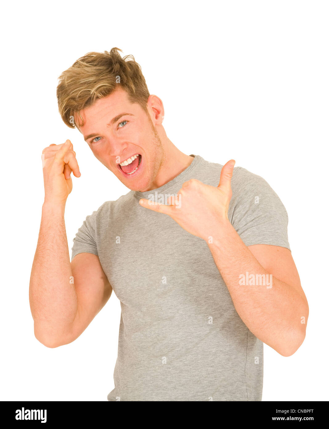 Young man making hang loose hand signals Stock Photo