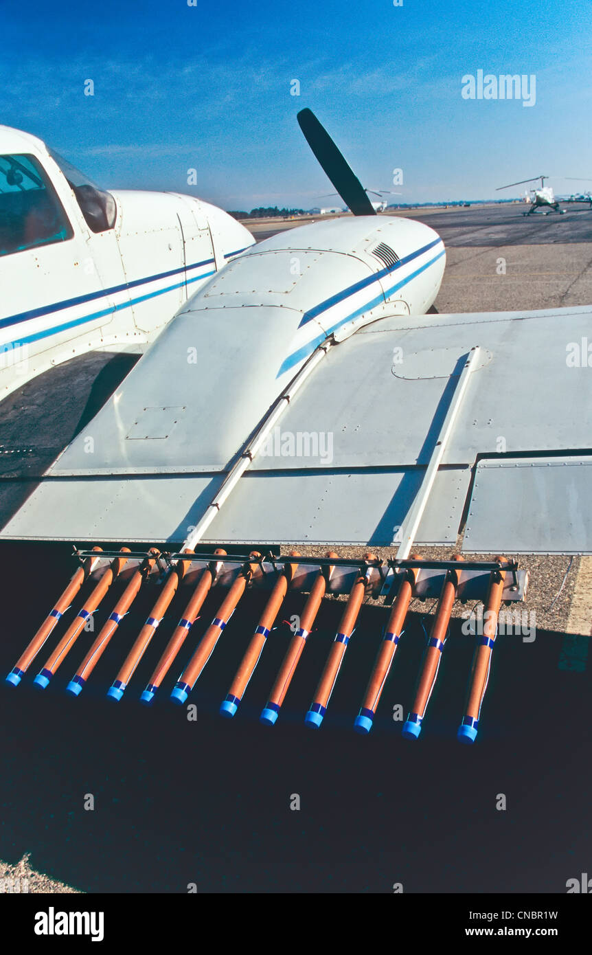 Aircraft, cloud seeding, flares. Stock Photo