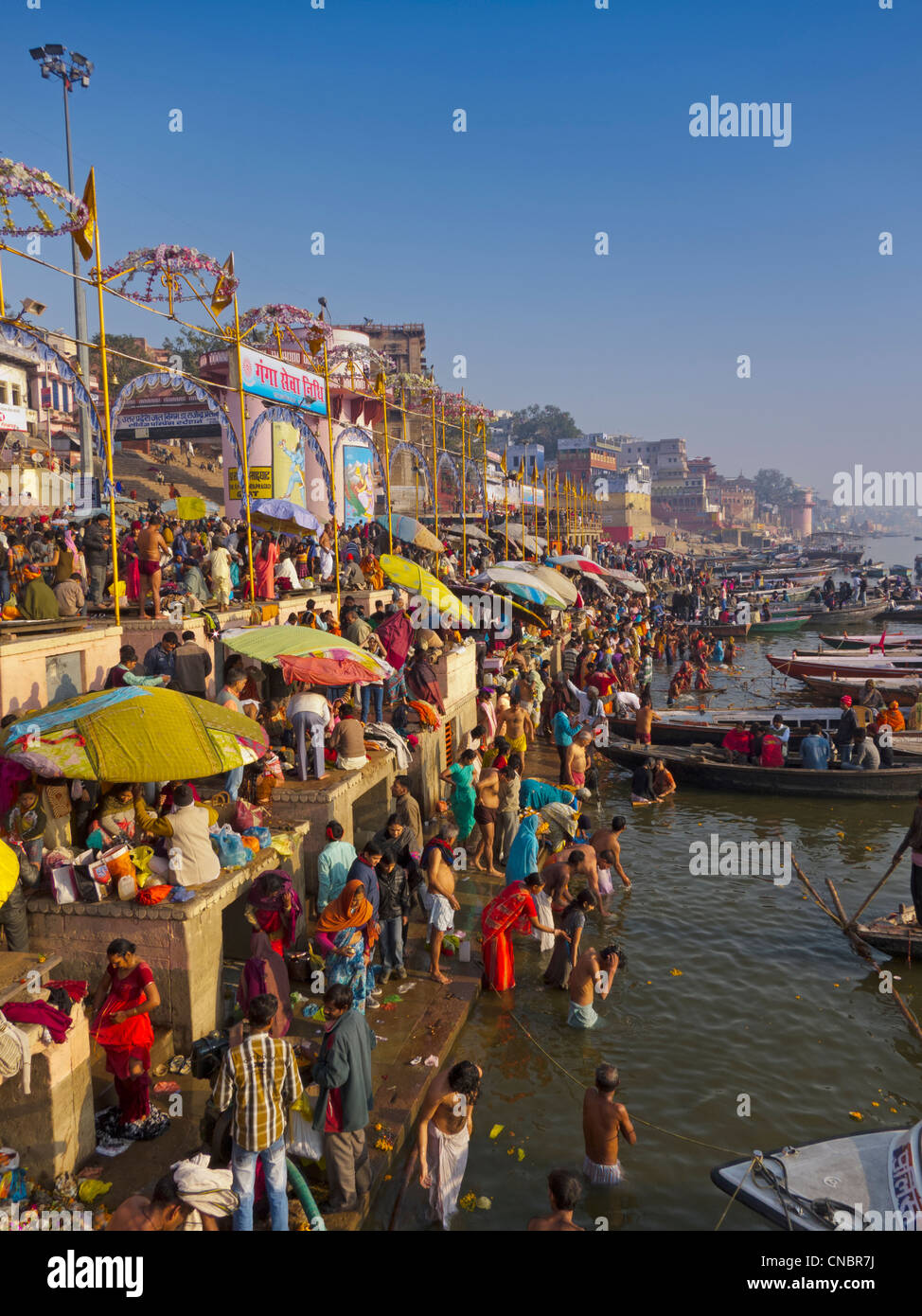 India, Uttar Pradesh, Varanasi, Pilgrims bathing and praying in the Ganges River Stock Photo