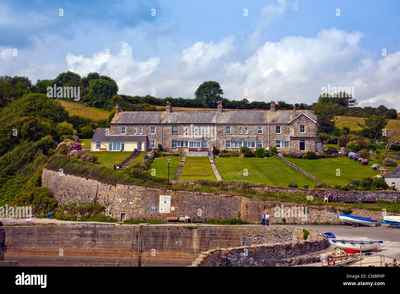 Former coastguard cottages above the harbor entrance in Charlestown