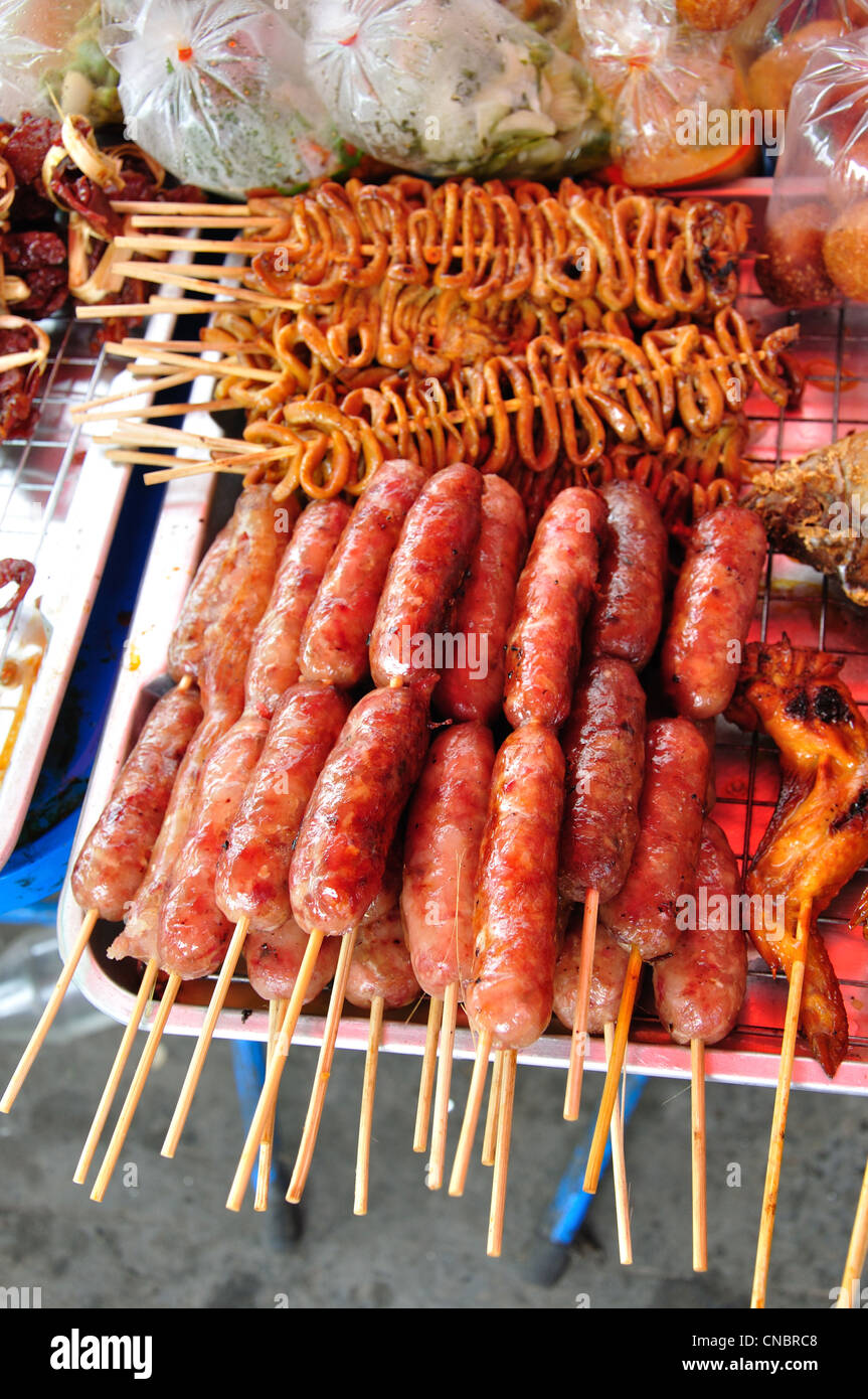 Cooked meat skewers on street stall, Tikathananon Road, Udon Thani, Udon Thani Province, Thailand Stock Photo