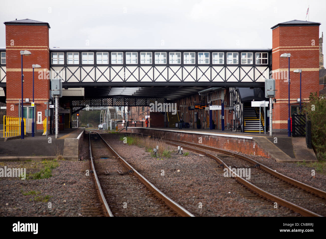 Grimsby Town, North Lincolnshire, England bridge crossing tracks leading to train station and platform Stock Photo