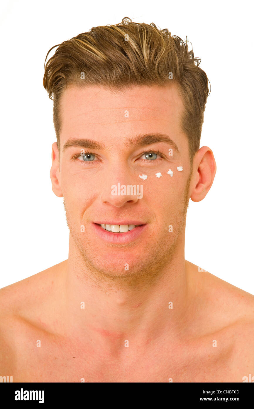 young man with anti-wrinkle cream Stock Photo