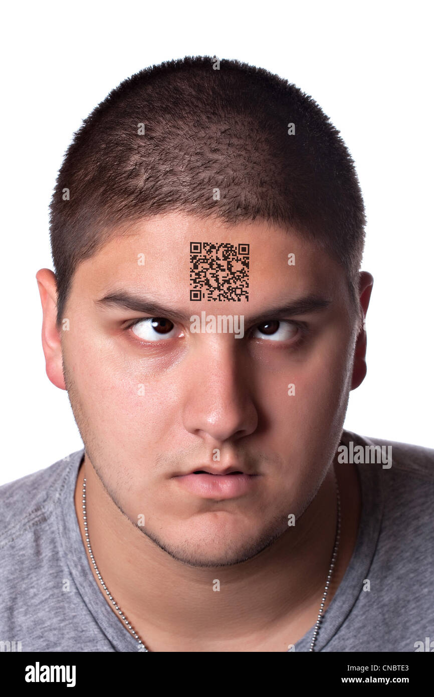A young man that looks very tired and cross eyed with his eyes looking upward towards his forehead. Stock Photo