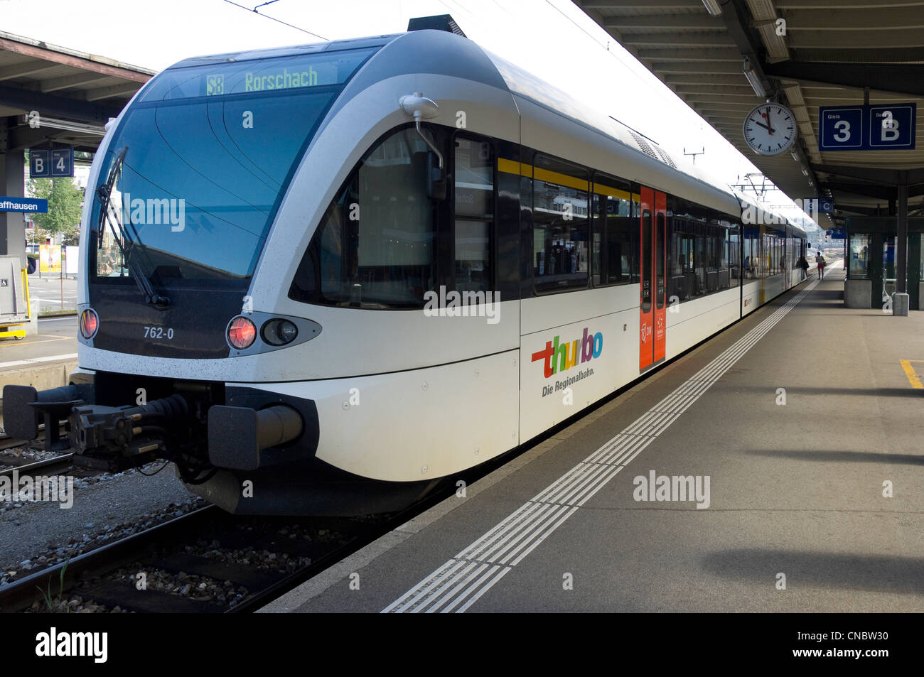Horizontal view of a Stadler GTW train waiting at the platform of Schaffhausen train station. Stock Photo