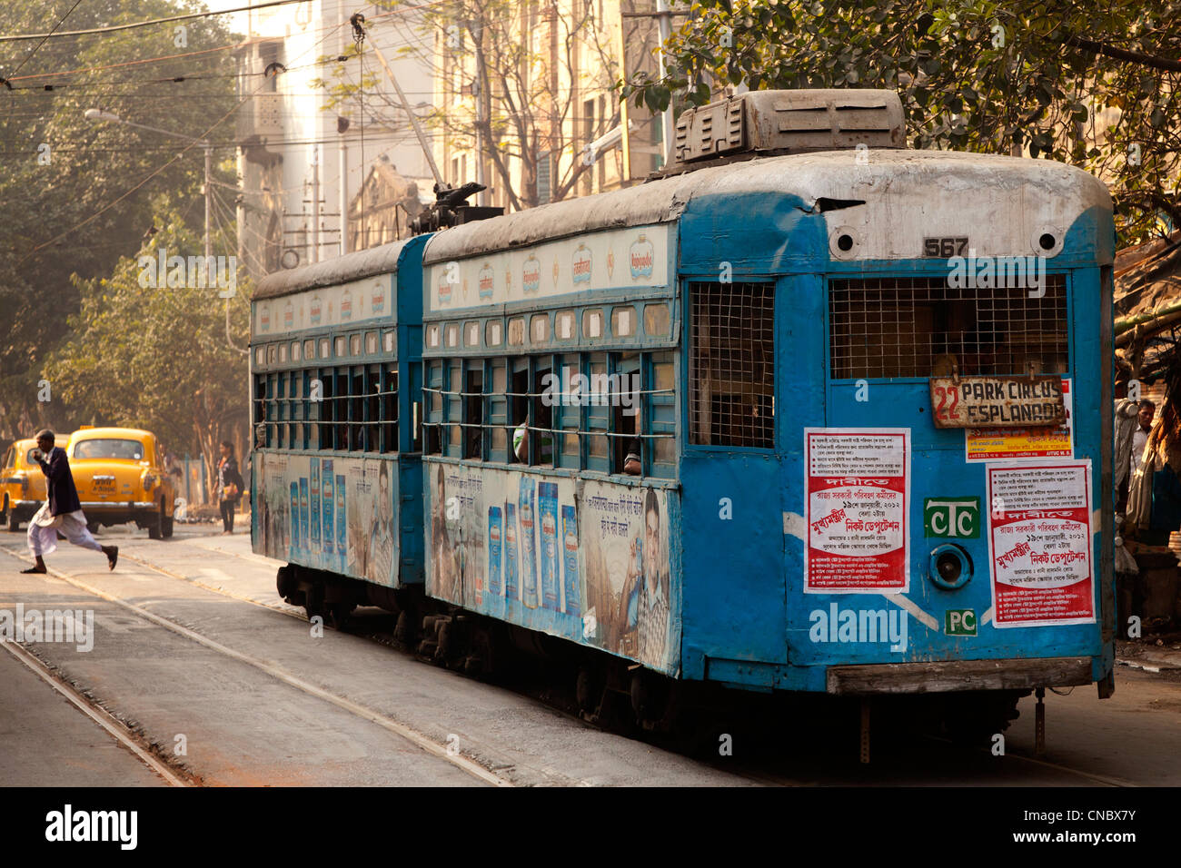 India, West Bengal, Kolkata (calcutta), tram and yellow ambassador taxis Stock Photo