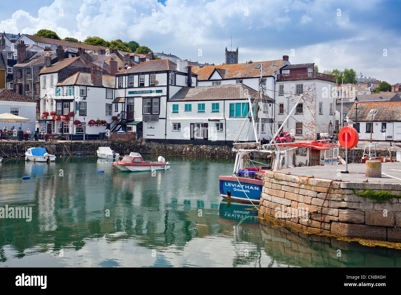 A mixture of different inns and pubs surround the original harbour in Falmouth, Cornwall, England, UK Stock Photo