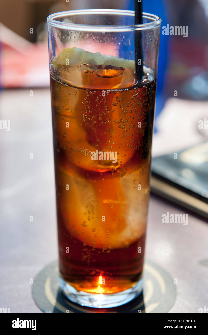 Cola drink in tumbler with ice and black straw Stock Photo