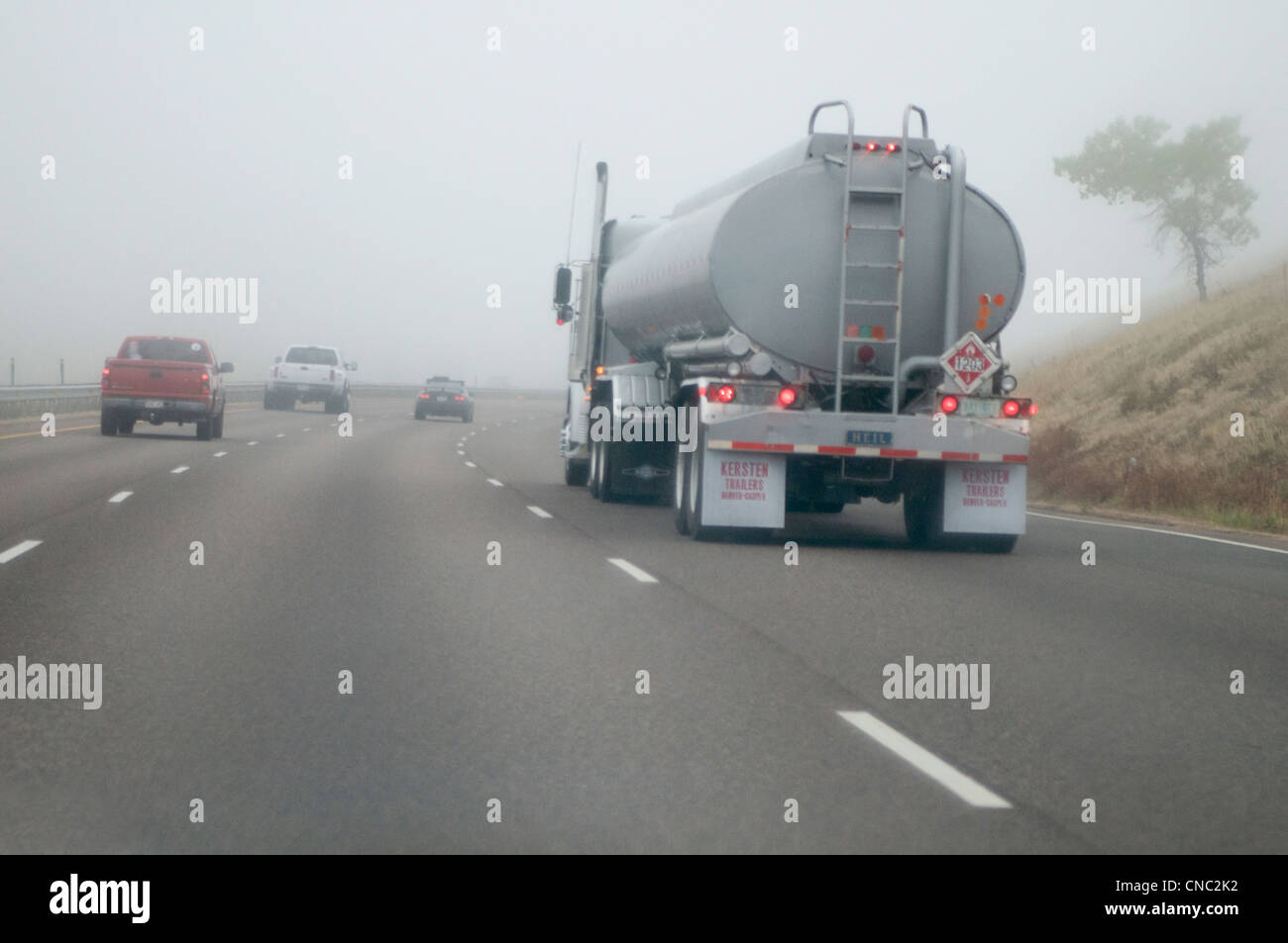 tanker truck driving in fog on highway near Denver, Colorado USA Stock Photo