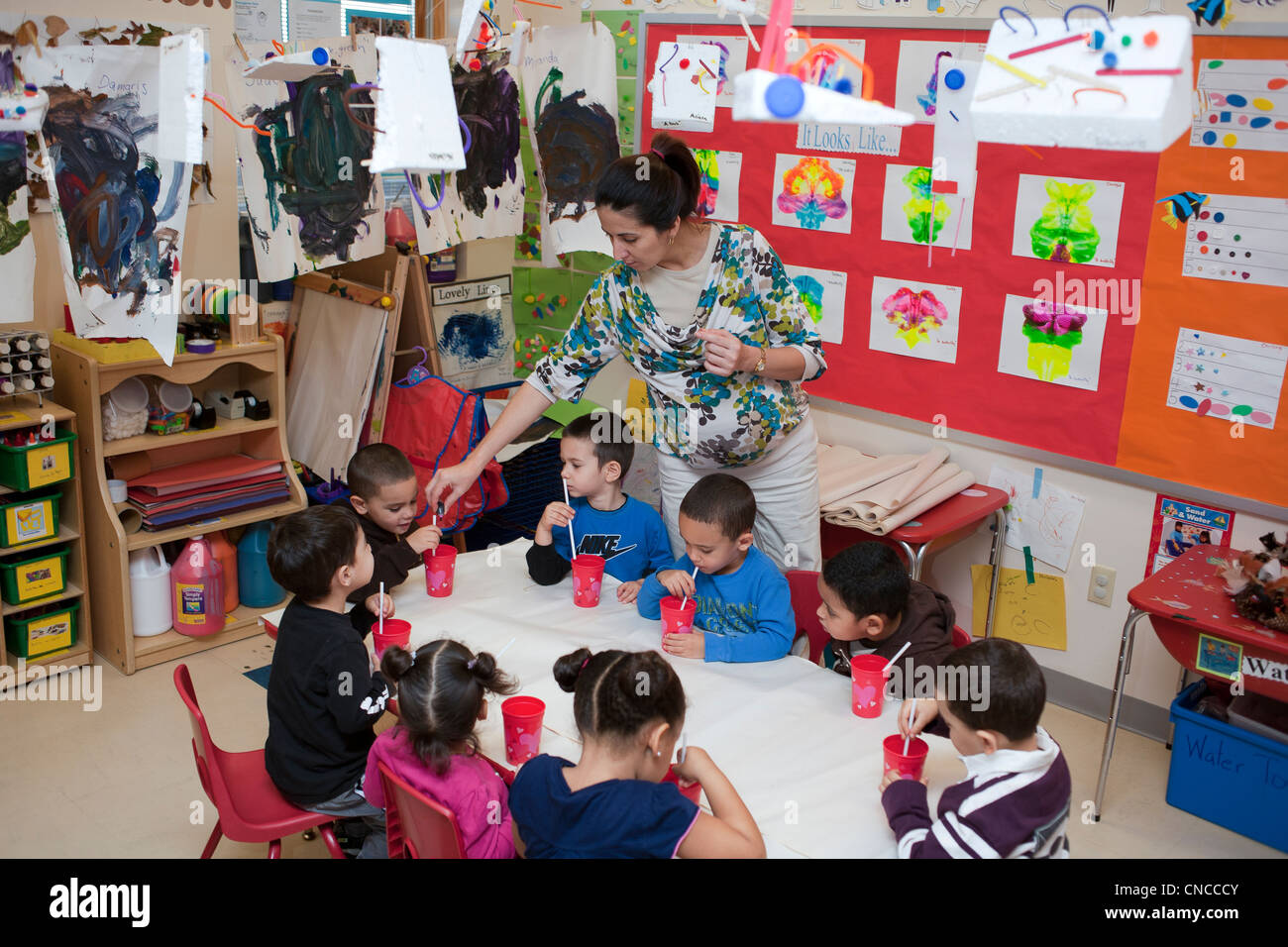 Preschool classroom teacher and students Stock Photo - Alamy