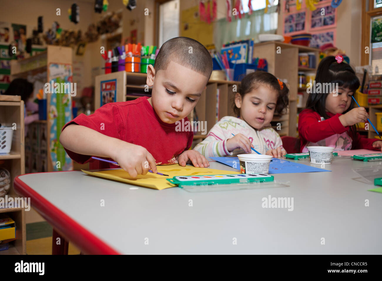 Preschool children in classroom Stock Photo - Alamy