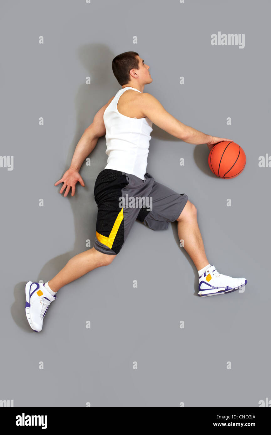Guy dribbling the ball ready to throw it in the basket, the above view Stock Photo