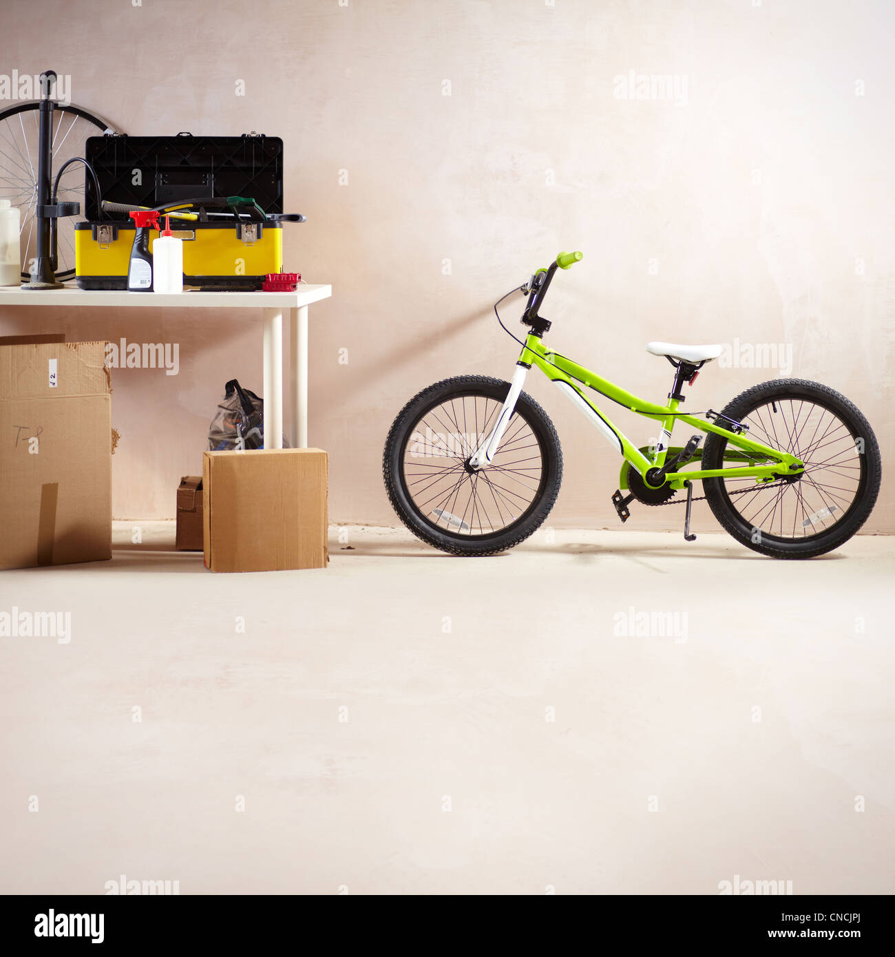 Image of mountain bike and some equipment in garage Stock Photo Alamy