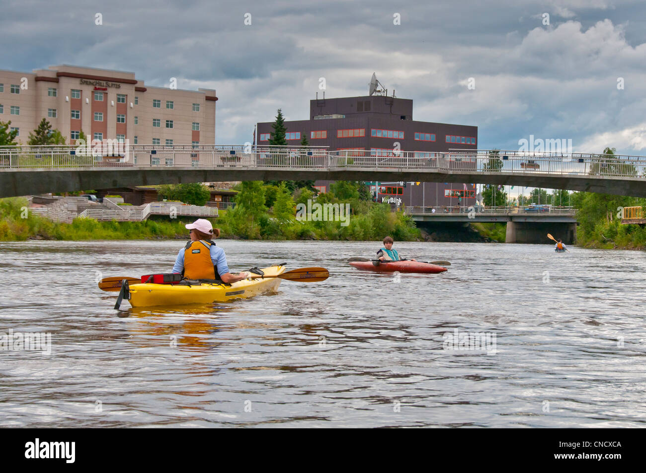 Family kayaking the Chena River in Fairbanks, Interior Alaska, Summer