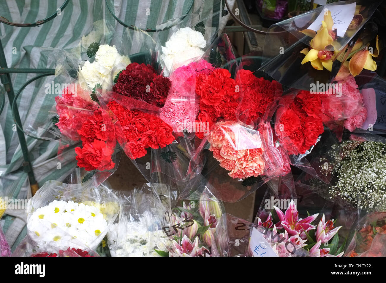 Cut Flowers for sale on a market stall in a High Street Stock Photo Alamy