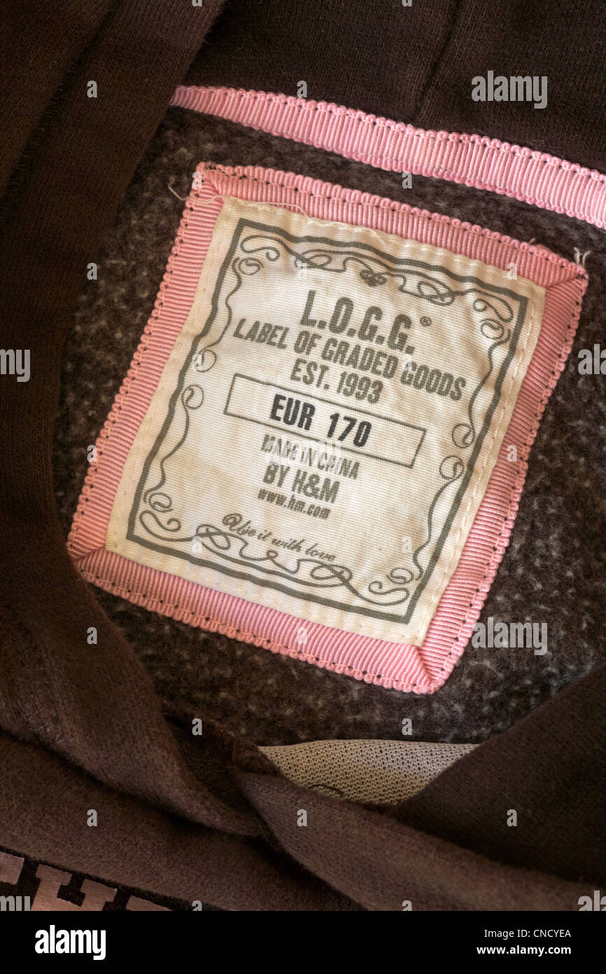 label in hooded brown top L.O.G.G. label of graded goods made in China by  H&M - sold in the UK United Kingdom, Great Britain Stock Photo - Alamy