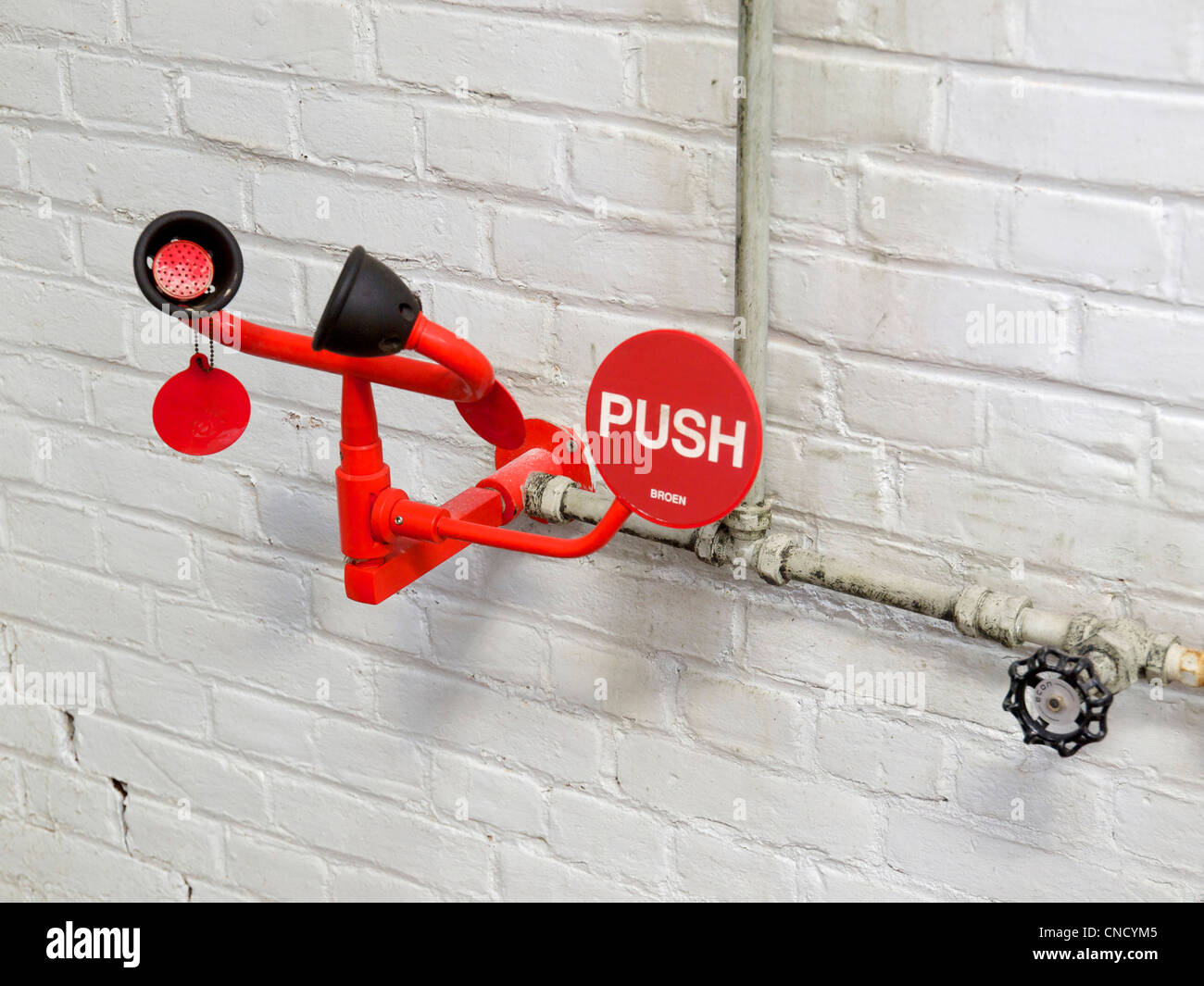 Emergency eyewash device station in factory in Groningen, the Netherlands Stock Photo