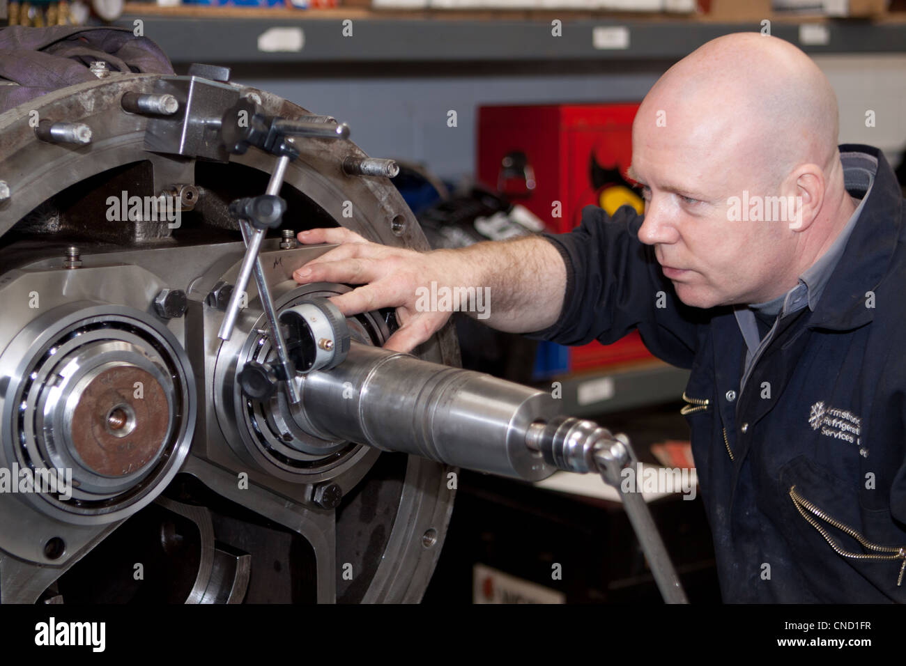 Engineer repairing heavy mechanical equipment Stock Photo