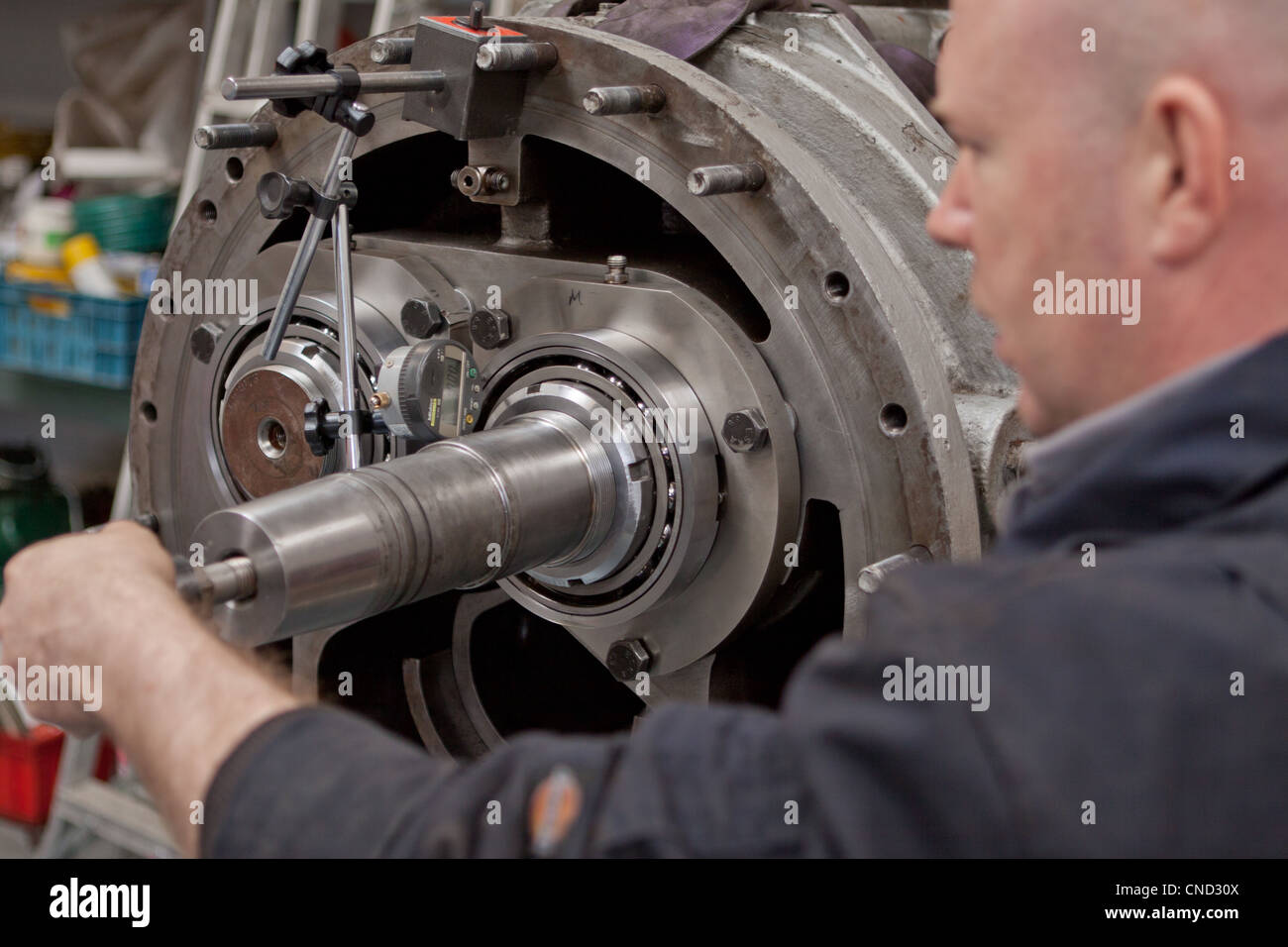Engineer repairing heavy mechanical equipment Stock Photo Alamy