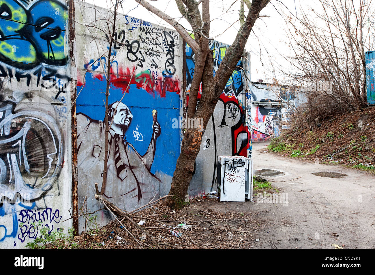 Friedrichshain district of Berlin with street art graffiti in a derelict area close to the river Stock Photo