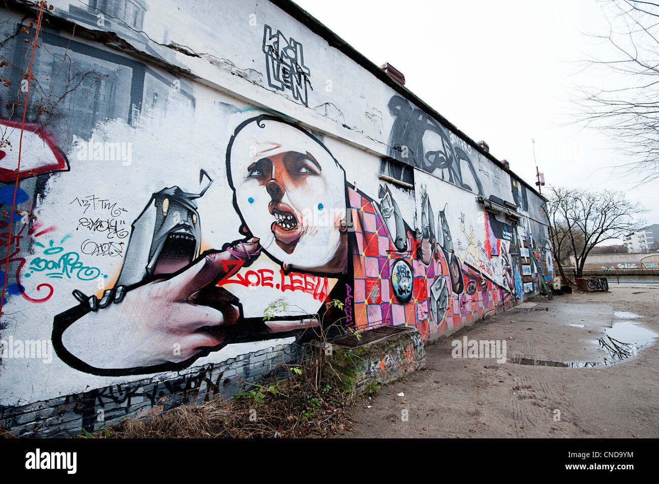 Friedrichshain district of Berlin with street art graffiti in a derelict area close to the river Stock Photo