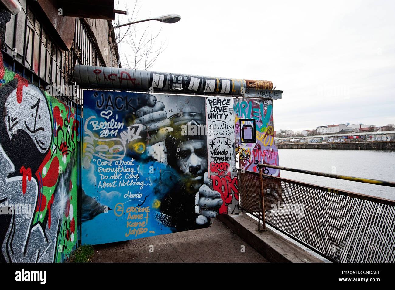 Friedrichshain district of Berlin with street art graffiti in a derelict area close to the river Stock Photo