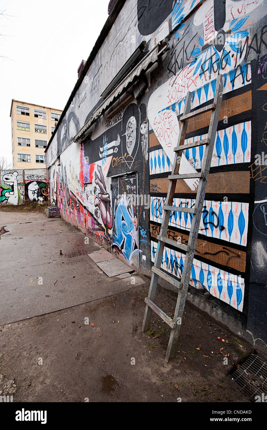 Friedrichshain district of Berlin with street art graffiti in a derelict area close to the river Stock Photo