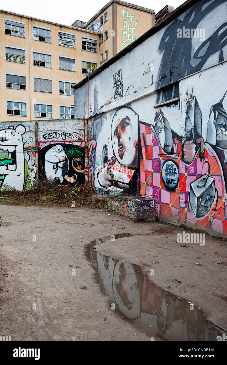 Friedrichshain district of Berlin with street art graffiti in a derelict area close to the river Stock Photo