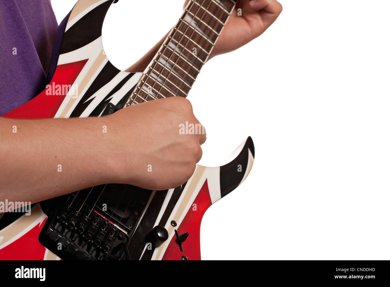 Closeup of a mans hands strumming an electric guitar isolated over a white background. Stock Photo
