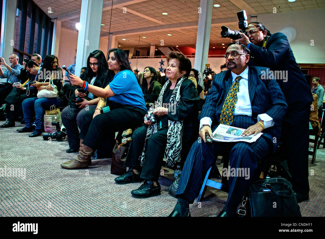 New Haven, CT USA-- The media asks Bollywood film superstar Shah Rukh Khan questions during a press conference as he prepared to greet a packed house of fans at the Shubert Theater in New Haven. Shah Rukh Khan was receiving the Chubb Fellowship from Yale University. Stock Photo