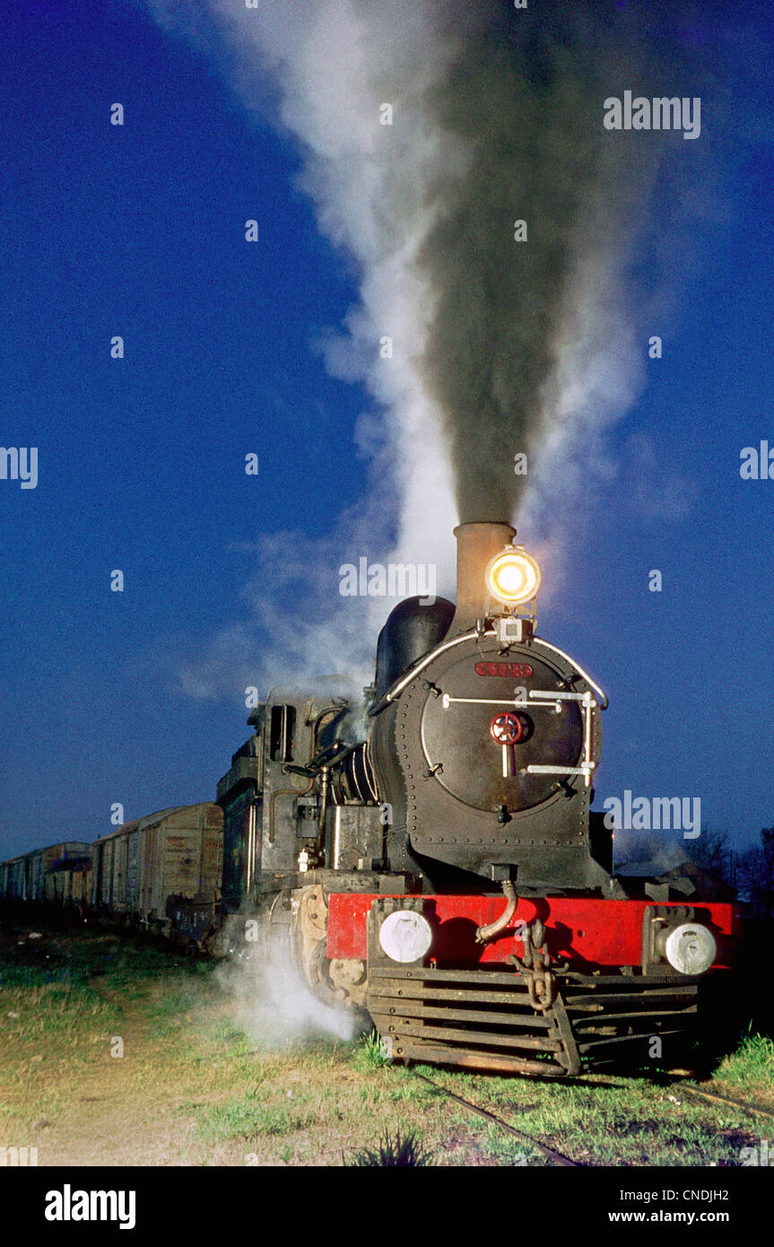 A night freight departs from Olavarria behind an Argentinean Railway's 11B Class 2-8-0. Stock Photo