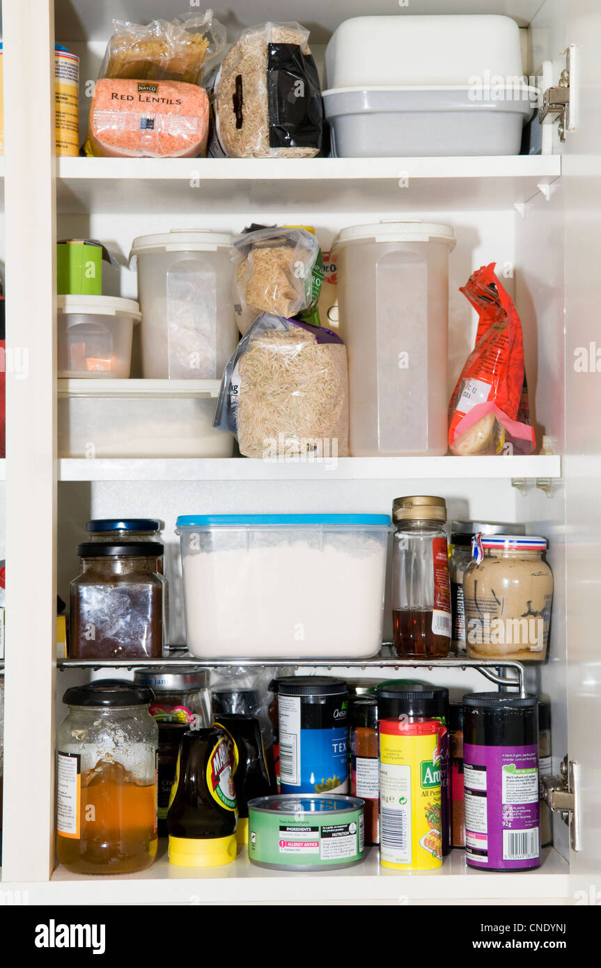 Kitchen cupboard contents showing cooking ingredients, food stuffs and