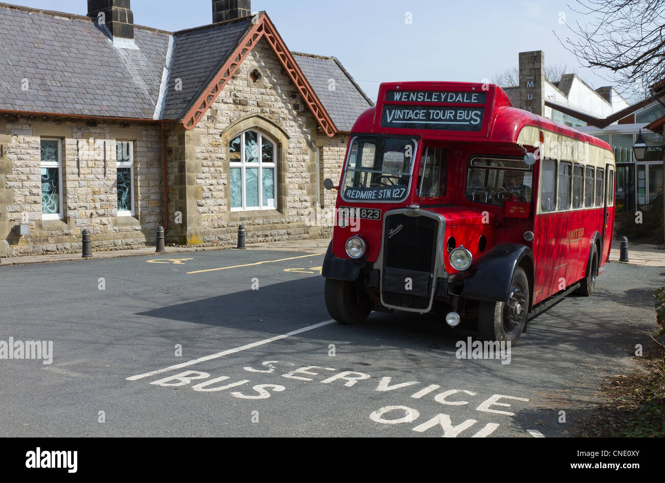 Vintage red single deck bus outside Hawes museum Wensleydale Stock Photo