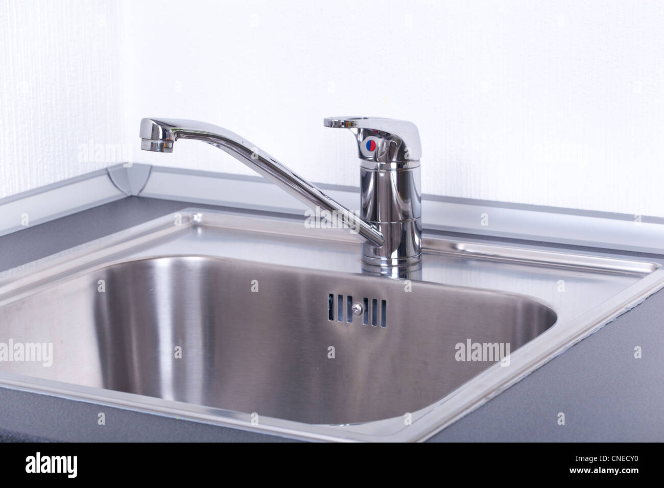 Water tap and sink in a modern kitchen, closeup Stock Photo - Alamy