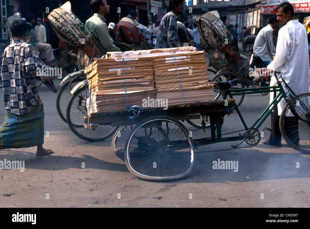 Street life dominated by Rickshaw, here an overloaded and broken Stock ...