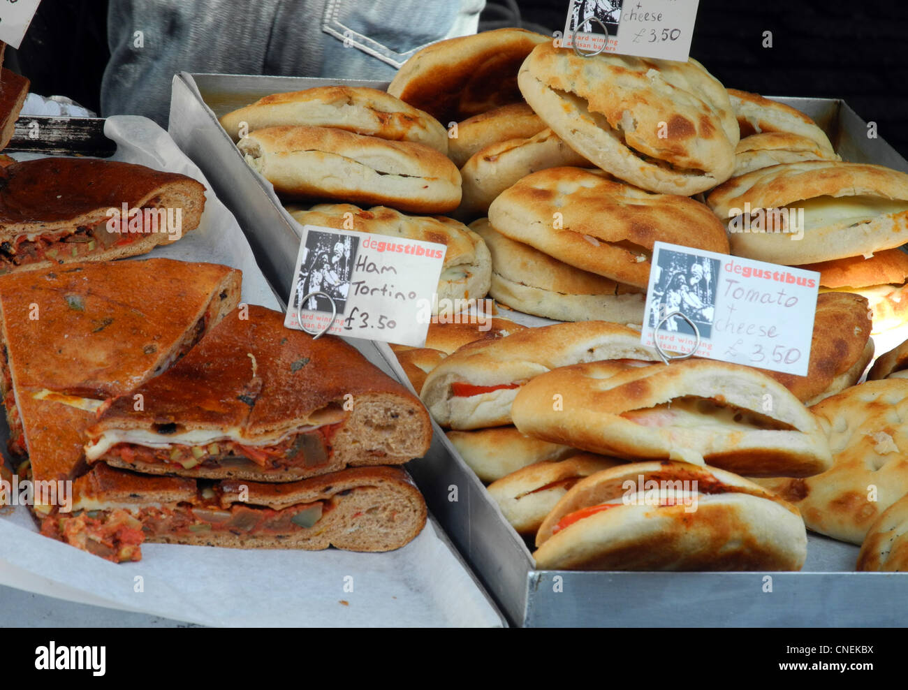 bread and tortillas Spanish omelets for sale on market in Covent Garden london UK Stock Photo