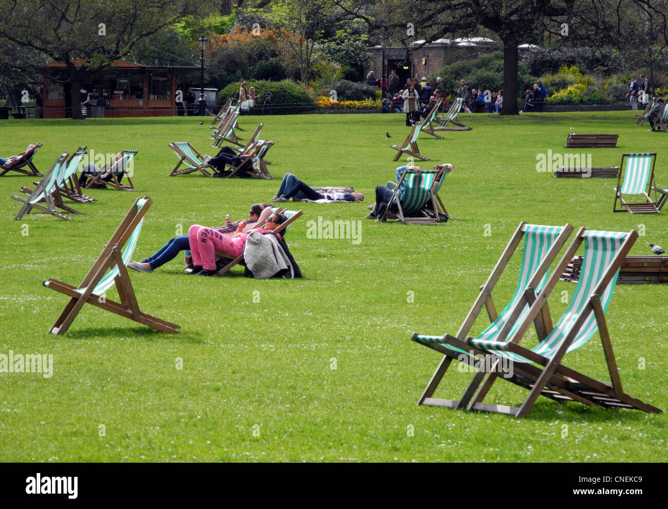 People relaxing on deckchairs in St James Park London Stock Photo - Alamy