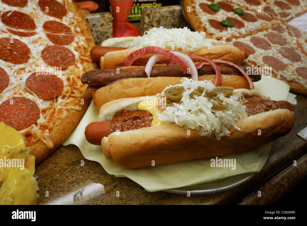 Hot Dogs and Pizza, on display for sale. Stock Photo