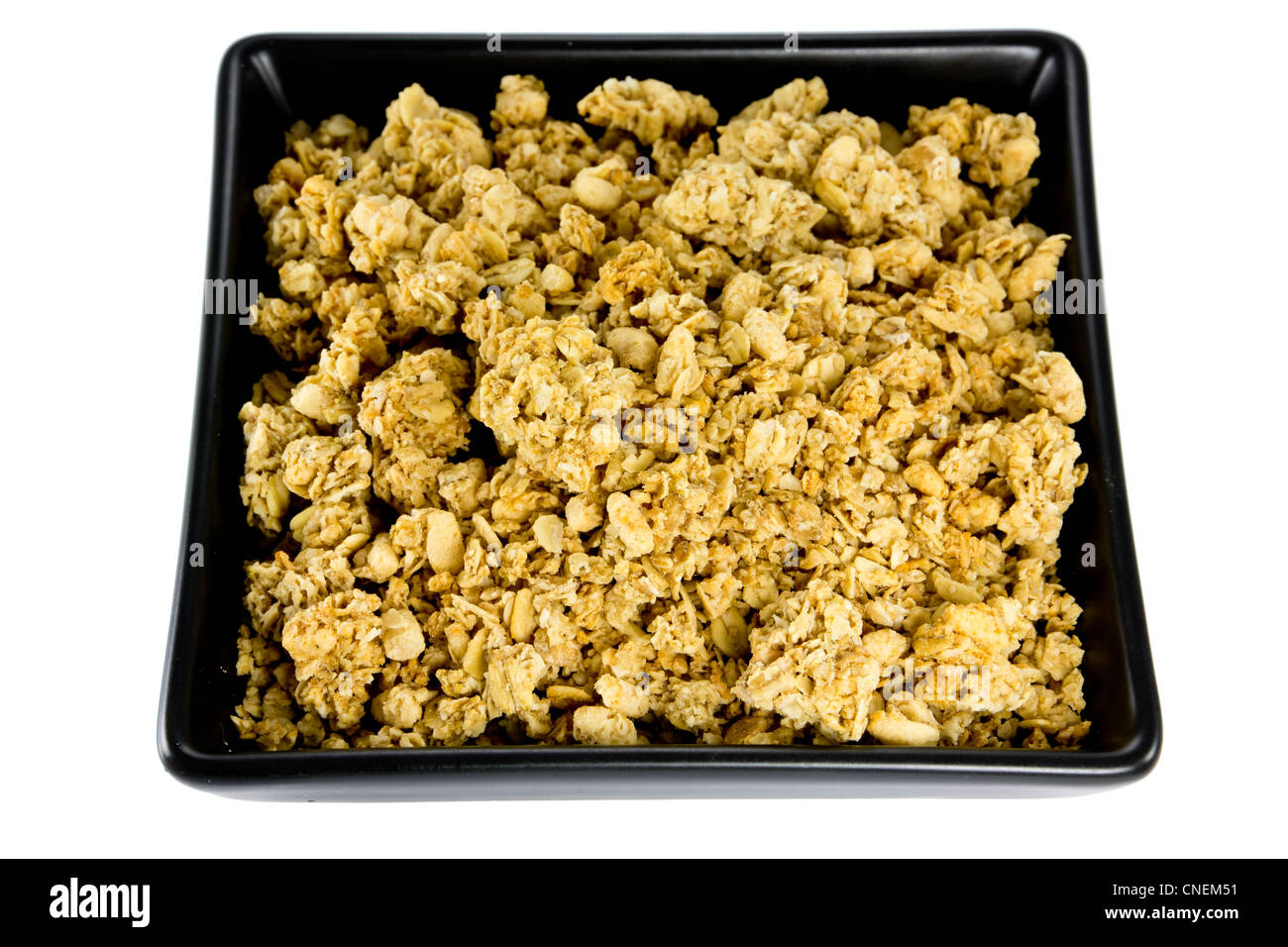 Picture of a black bowl with crunchy musli Stock Photo