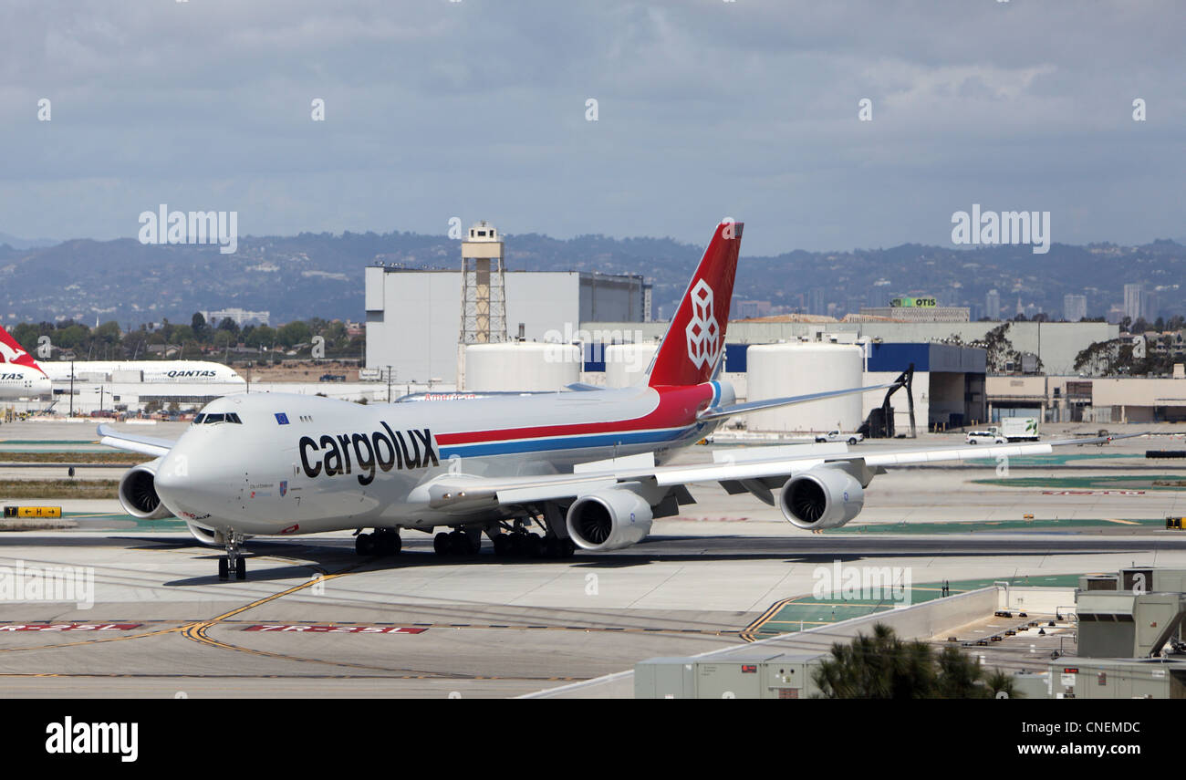 LOS ANGELES, CALIFORNIA, USA - APRIL 12, 2012 - Cargolux B747-8 Freighter jet plane taxis to the cargo terminal at Los Angeles I Stock Photo