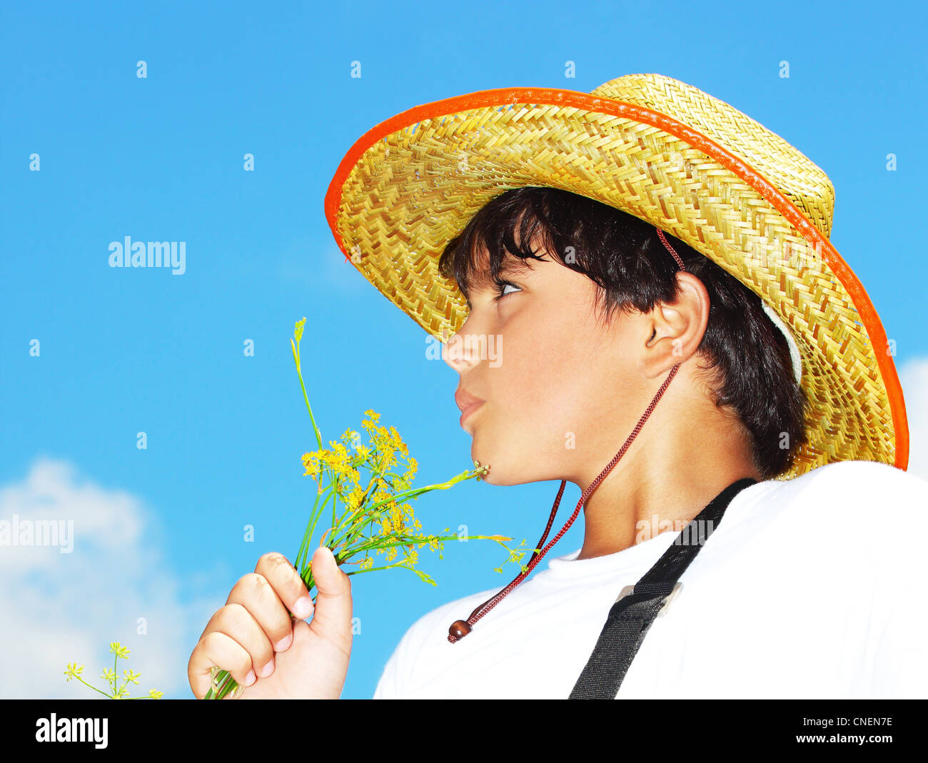 Portrait of a young beautiful boy over blue sky Stock Photo - Alamy
