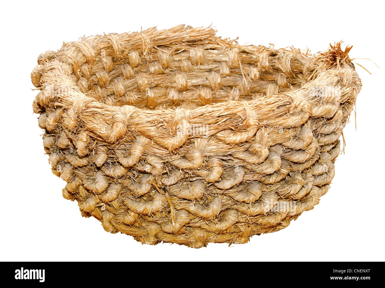 Hand-made straw basket to store dry things in a traditional village house, Ukraine Stock Photo
