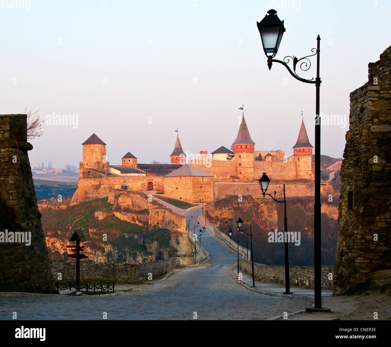 Old stone castle with towers and bridge at dawn Stock Photo - Alamy