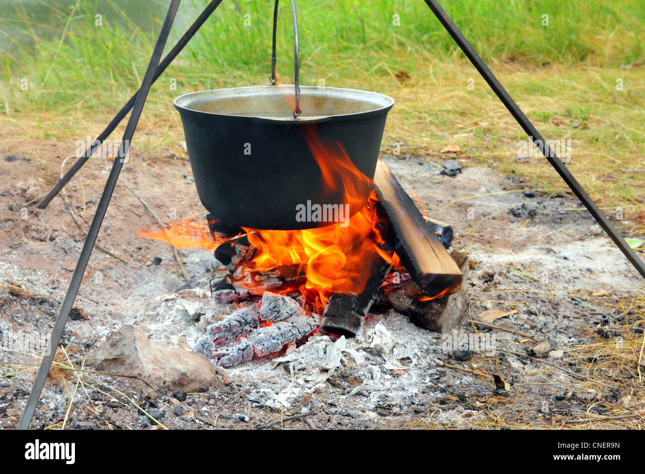 camping - kettle over campfire Stock Photo - Alamy