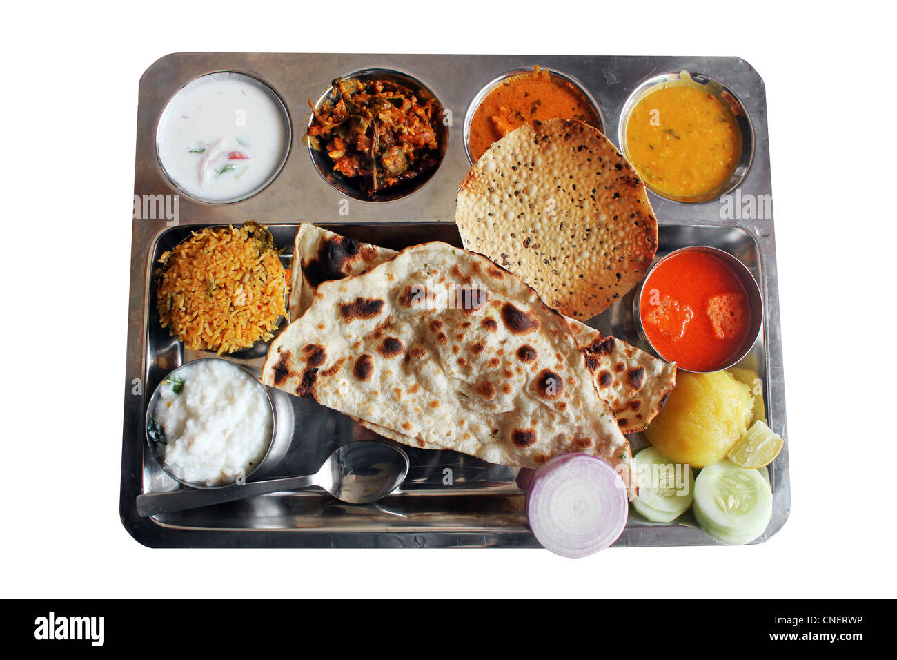 Traditional north indian plate meals or lunch with roti, biryani, curry and soup. Stock Photo