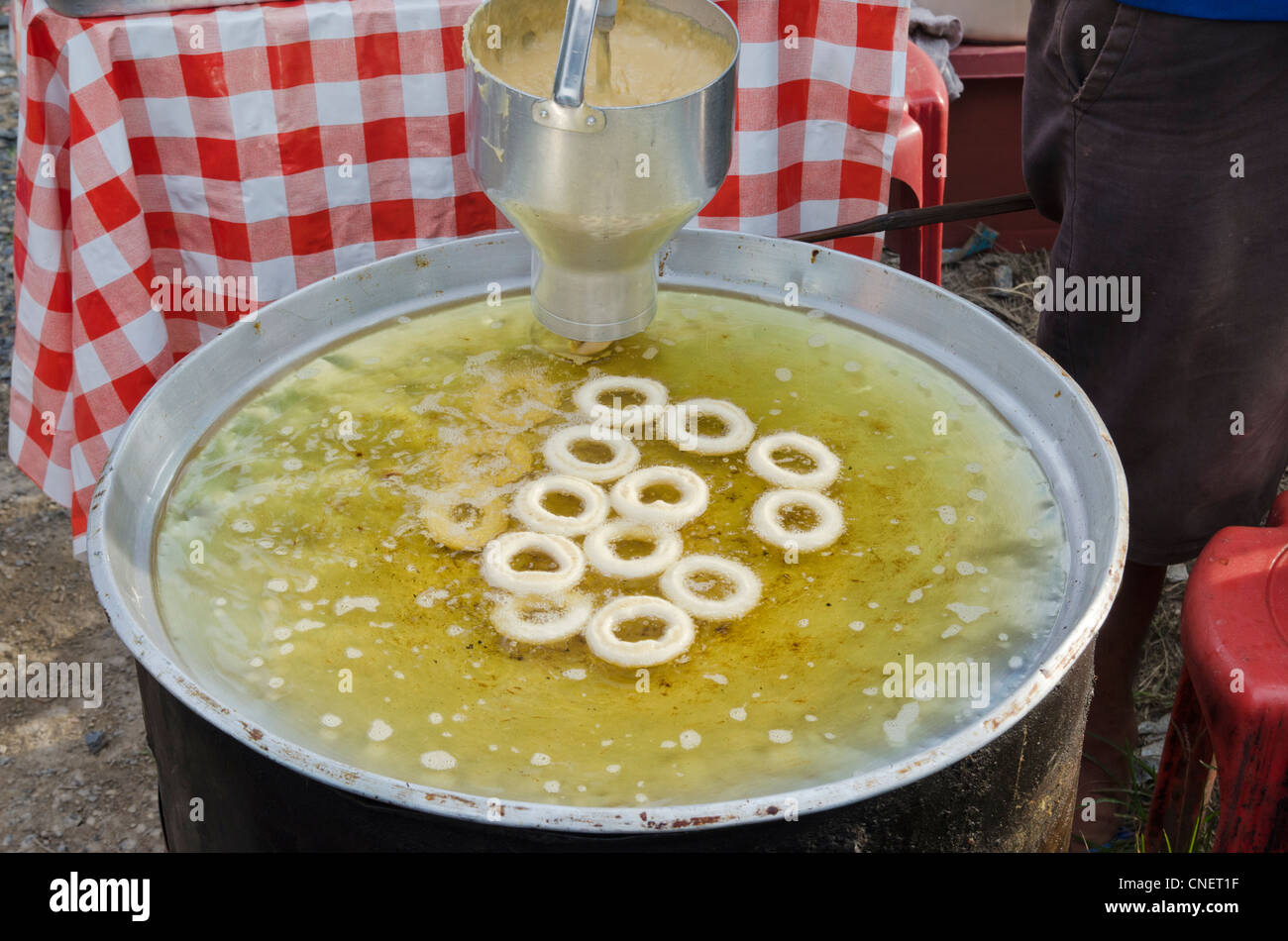 Fried rings of dough, a common snack at a Phuket market in Thailand Stock Photo