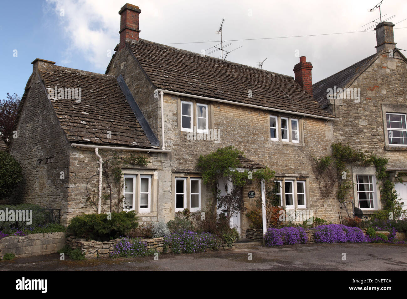 Pretty stone terraced cottage in the village of Biddestone, Wiltshire, England, UK Stock Photo