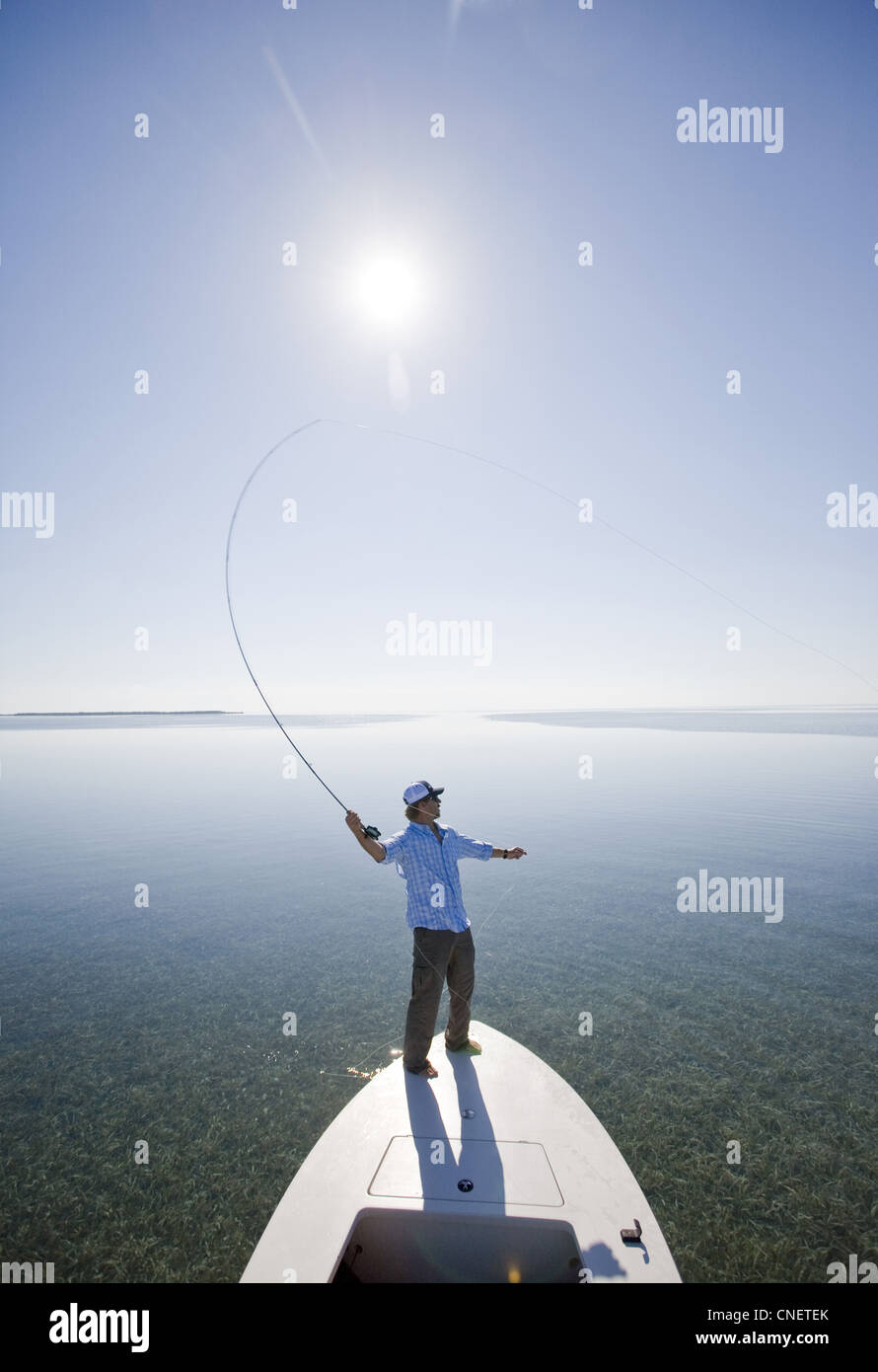 Man Fly Fishing From Bow of Boat, Florida Keys, USA Stock Photo Alamy