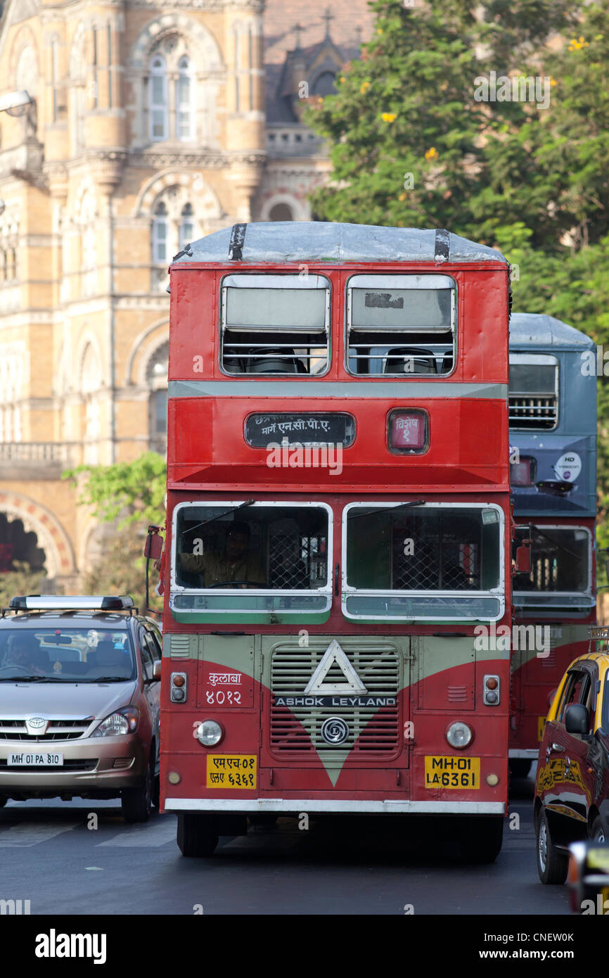 India, Mumbai, Ubiquitous Ashok Leyland red bus, near the Victoria Railway terminus. Stock Photo